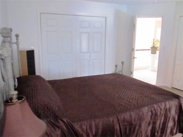 7 Rivers Edge Way Freetown, MA 02702 - Photo 13 of 25 a bedroom with a bed and a mirror