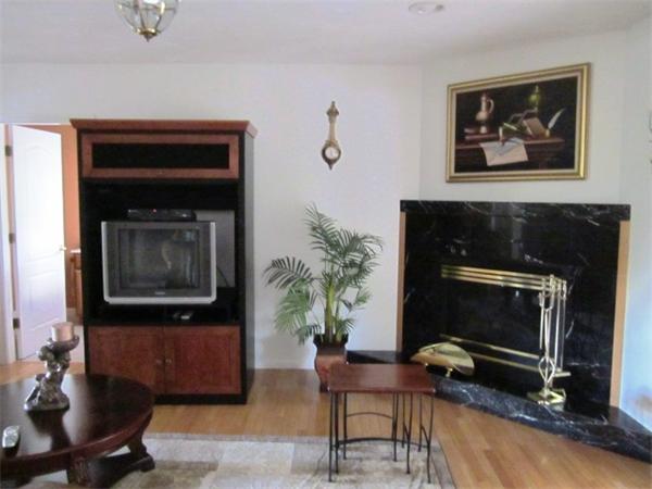 7 Rivers Edge Way Freetown, MA 02702 - Photo 3 of 25 a living room with furniture and a fireplace