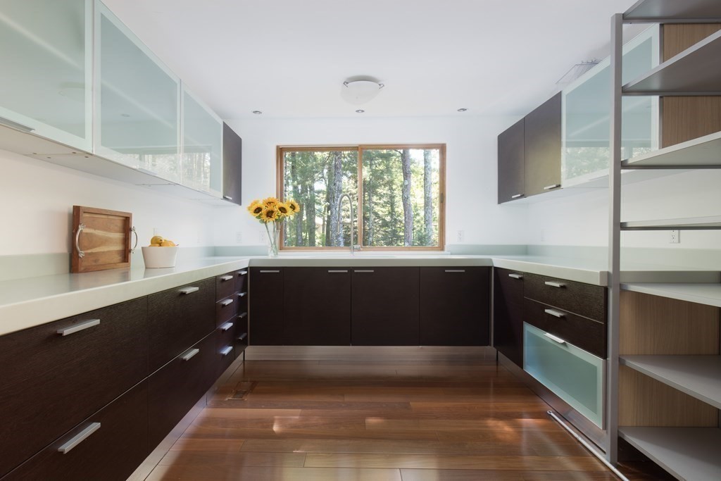 83 McAllister Drive Carlisle, MA 01741 - Photo 11 of 30 a kitchen with a window a sink and cabinets