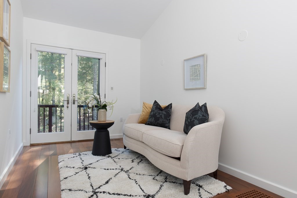 83 McAllister Drive Carlisle, MA 01741 - Photo 16 of 30 a living room with furniture and a window