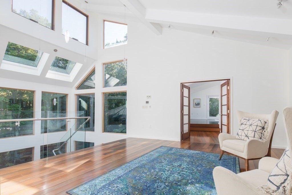 83 McAllister Drive Carlisle, MA 01741 - Photo 19 of 30 a living room with furniture and a large window