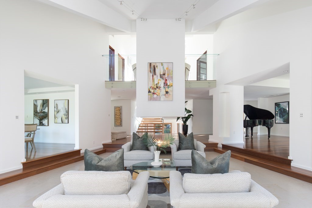 83 McAllister Drive Carlisle, MA 01741 - Photo 2 of 30 a living room with furniture and a fireplace