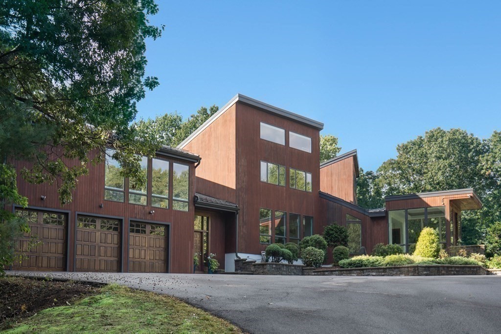 83 McAllister Drive Carlisle, MA 01741 - Photo 27 of 30 a front view of a house with garden