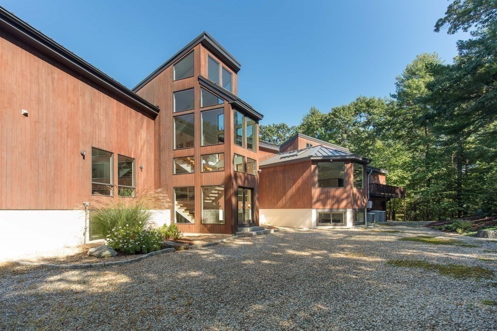 83 McAllister Drive Carlisle, MA 01741 - Photo 28 of 30 a view of a house with a yard