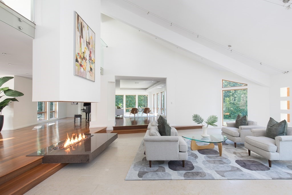 83 McAllister Drive Carlisle, MA 01741 - Photo 3 of 30 a living room with furniture and a large window