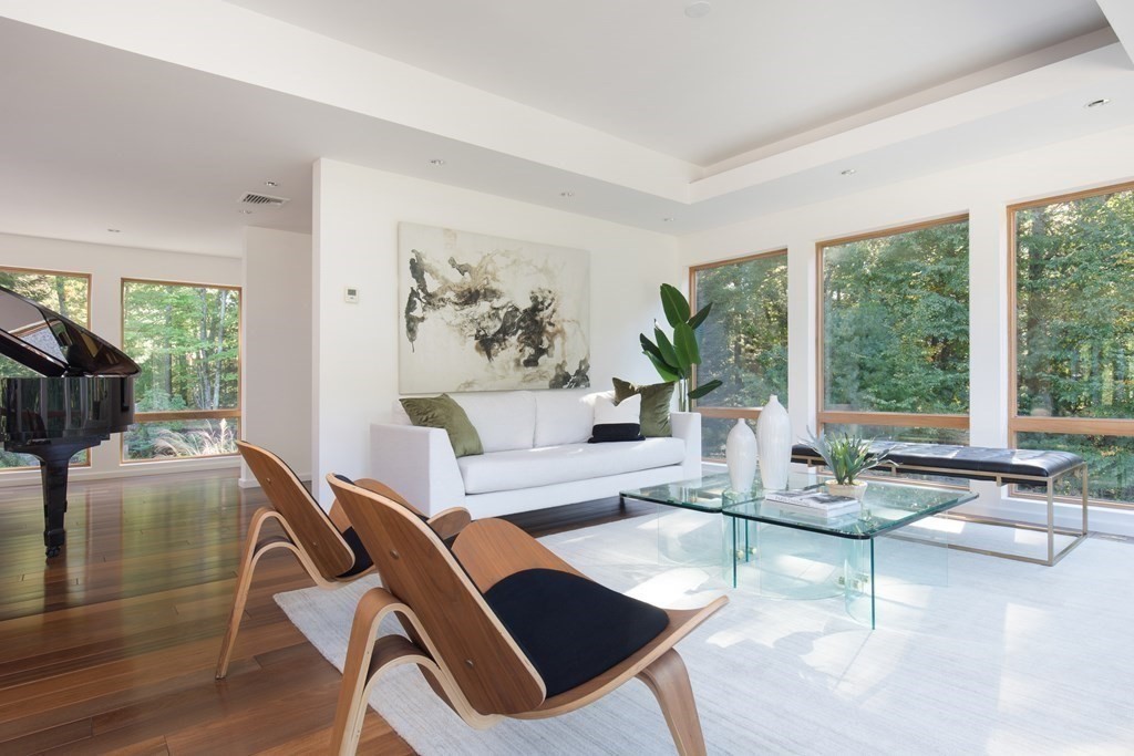 83 McAllister Drive Carlisle, MA 01741 - Photo 4 of 30 a living room with furniture and a large window