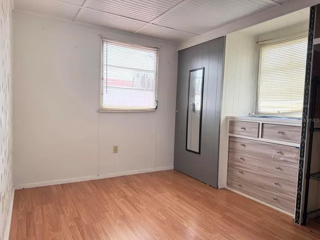 a view of a dresser in front of a window