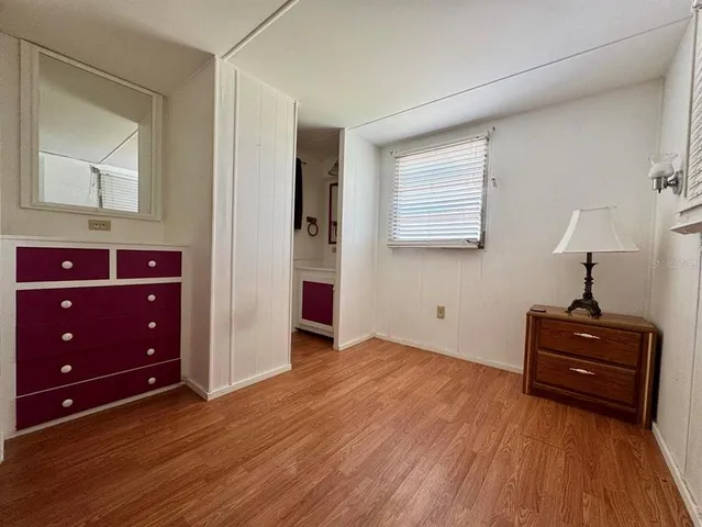 a room with a dresser and a mirror