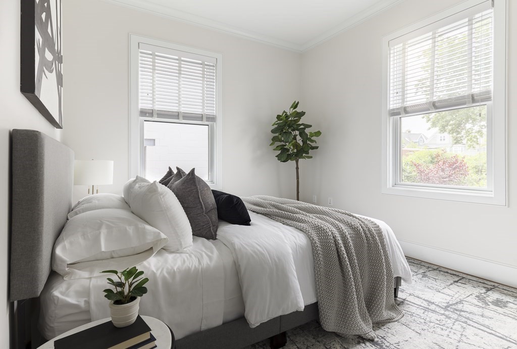 11 Tannery Brook Row, Unit 2 Somerville, MA 02144 - Photo 12 of 17 a bedroom with bed and a window