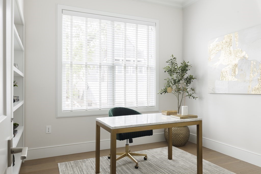 11 Tannery Brook Row, Unit 2 Somerville, MA 02144 - Photo 14 of 17 a view of a room with a table and chair in a room