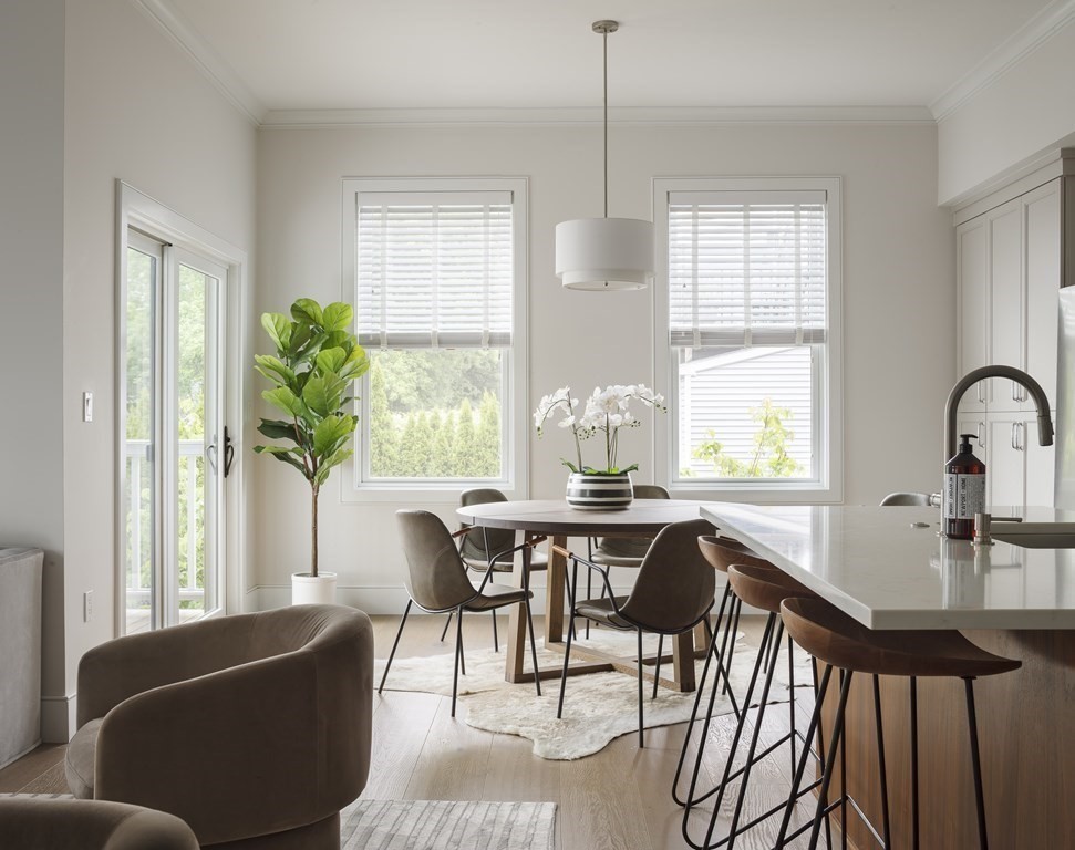11 Tannery Brook Row, Unit 2 Somerville, MA 02144 - Photo 3 of 17 a view of a dining room with furniture window and outside view