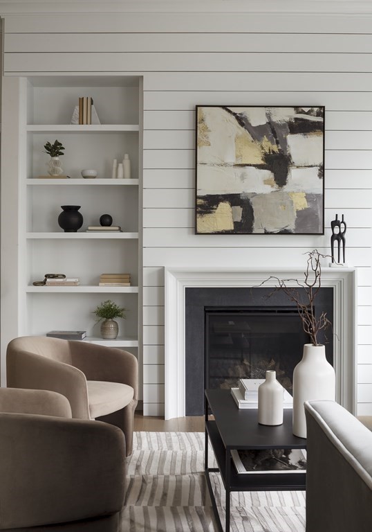 11 Tannery Brook Row, Unit 2 Somerville, MA 02144 - Photo 7 of 17 a living room with furniture and a fireplace