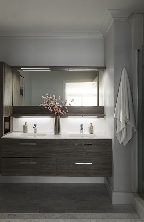 11 Tannery Brook Row, Unit 2 Somerville, MA 02144 - Photo 9 of 17 a bathroom with a sink and a mirror