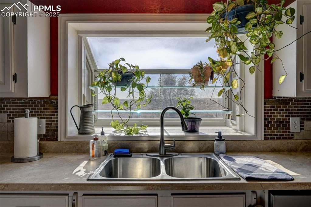 35355 Funk Road Calhan, CO 80808 - Photo 12 of 31 a kitchen with a sink and a microwave
