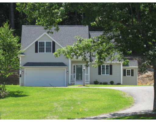 5 Reed Lane Littleton, MA 01460 - Photo 1 of 20 a front view of a house with a yard