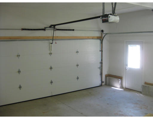 5 Reed Lane Littleton, MA 01460 - Photo 18 of 20 a view of a room with racks on the wall