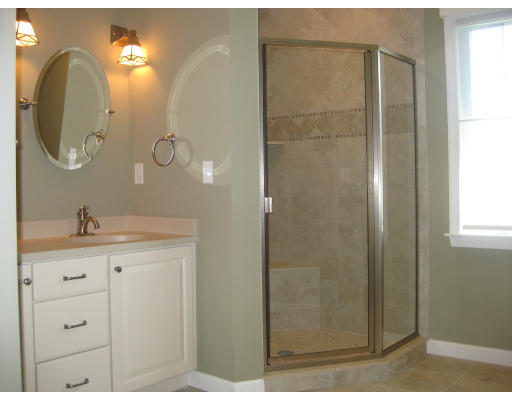 5 Reed Lane Littleton, MA 01460 - Photo 10 of 20 a bathroom with a granite countertop sink a mirror and shower