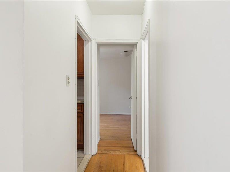665 Thwaites Place, Unit 3N Bronx, NY 10467 - Photo 7 of 10 a view of a hallway with wooden floor