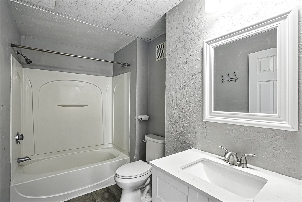 531 Main Street, Unit 410M Worcester, MA 01608 - Photo 15 of 29 a bathroom with a sink toilet and shower