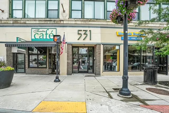 a view of a building with sitting area
