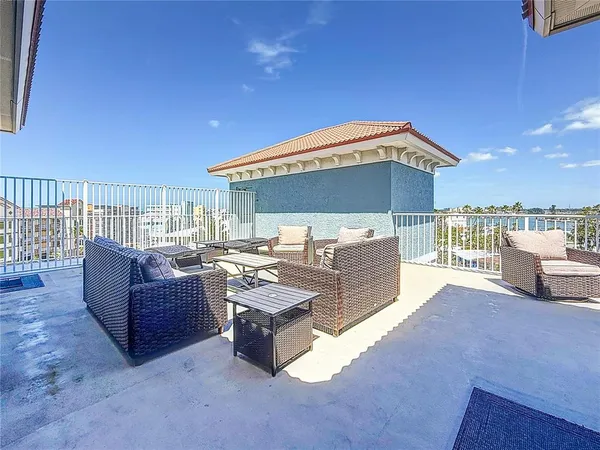 an aerial view of a house with swimming pool and patio