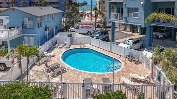 a workspace room with furniture and wooden floor