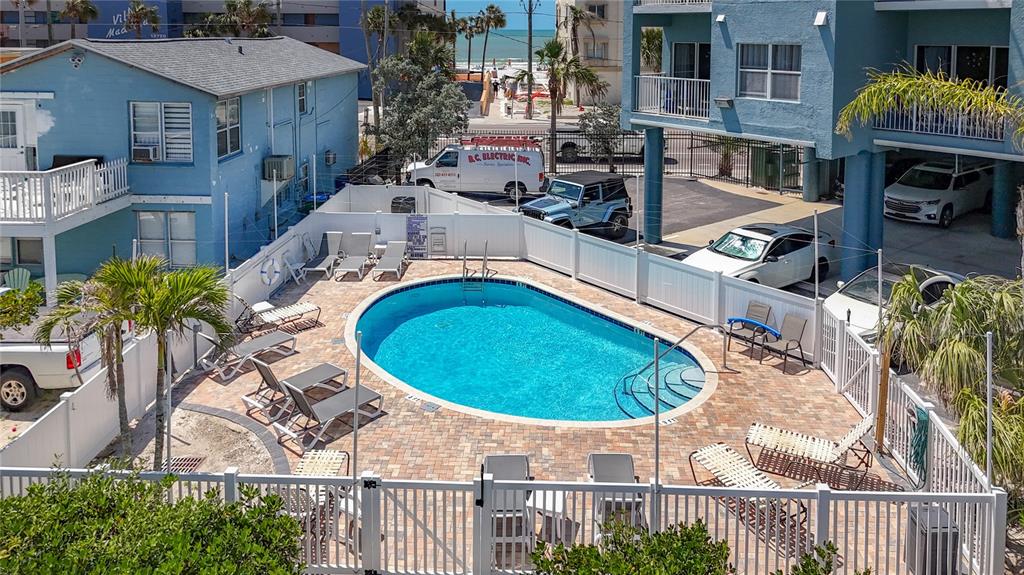 13999 Gulf Boulevard, Unit 501 Madeira Beach, FL 33708 - Photo 14 of 58 an aerial view of a house with swimming pool and patio