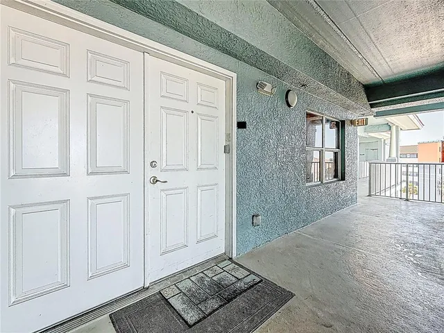 a kitchen with a sink a refrigerator and a stove