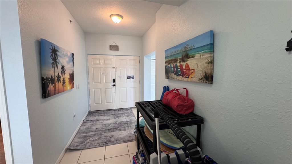 13999 Gulf Boulevard, Unit 501 Madeira Beach, FL 33708 - Photo 16 of 58 a workspace room with furniture and wooden floor