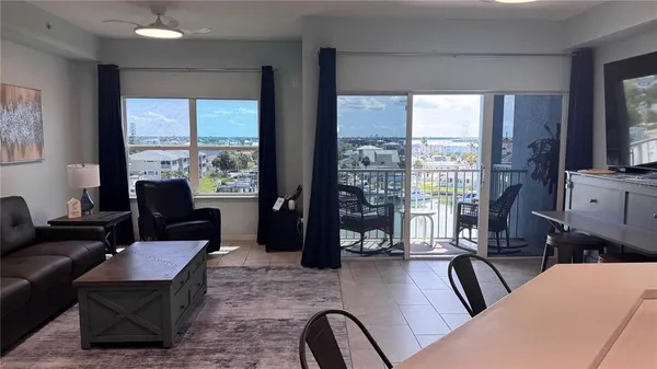 a room with furniture and a large window