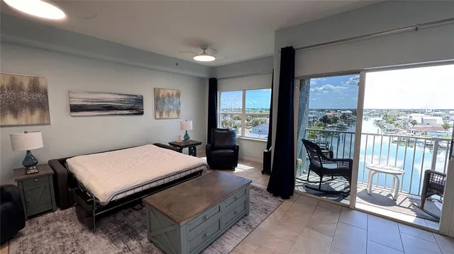 a view of a balcony with furniture and a chandelier