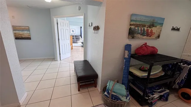 a view of a bedroom with a bed and glass door