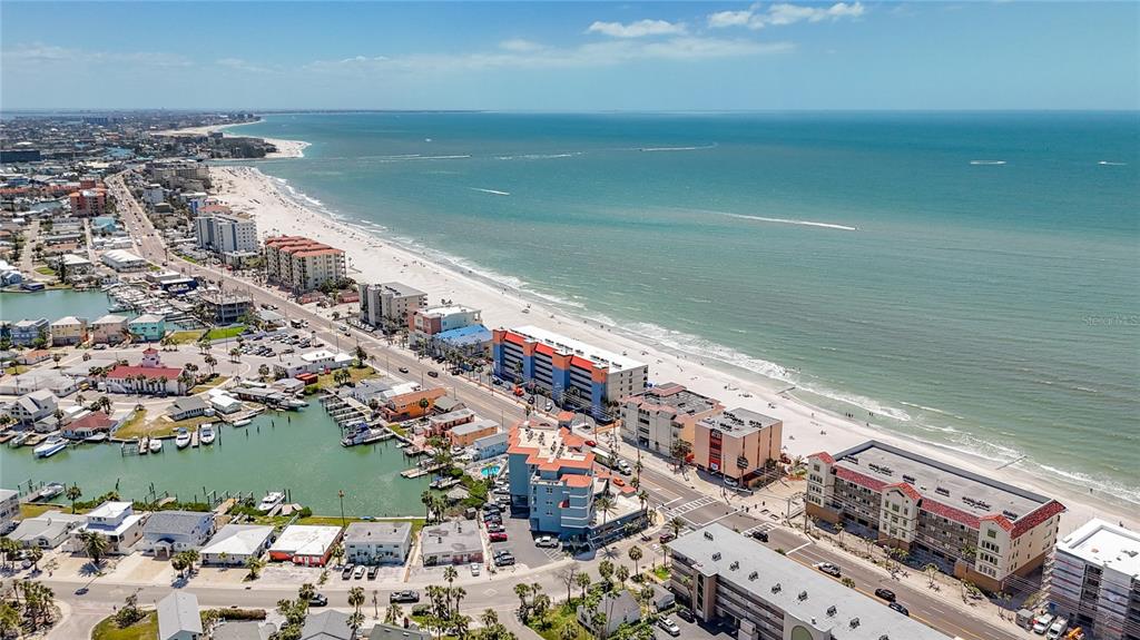13999 Gulf Boulevard, Unit 501 Madeira Beach, FL 33708 - Photo 4 of 58 a view of a city and ocean view