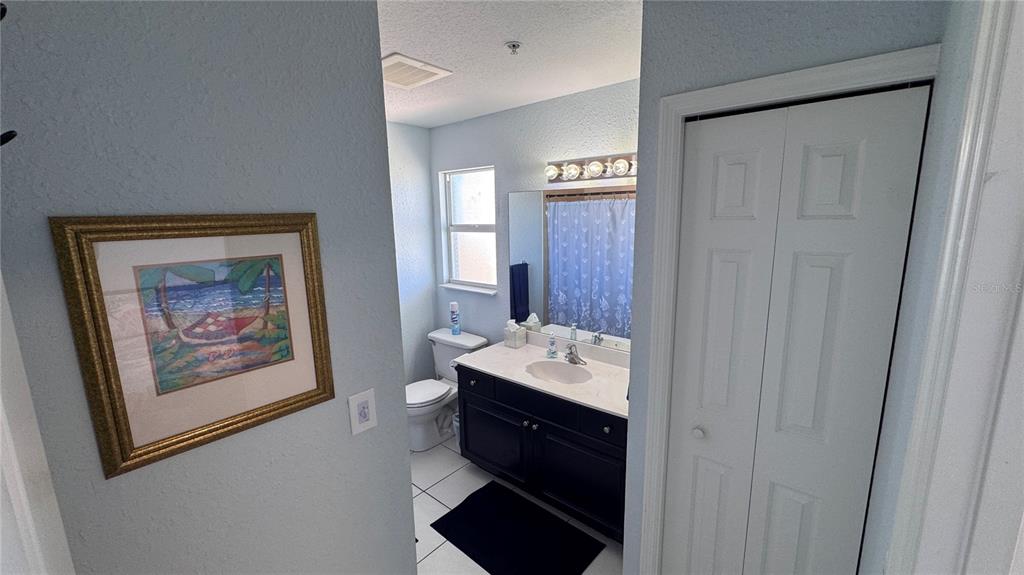 13999 Gulf Boulevard, Unit 501 Madeira Beach, FL 33708 - Photo 45 of 58 a bathroom with a sink and a mirror