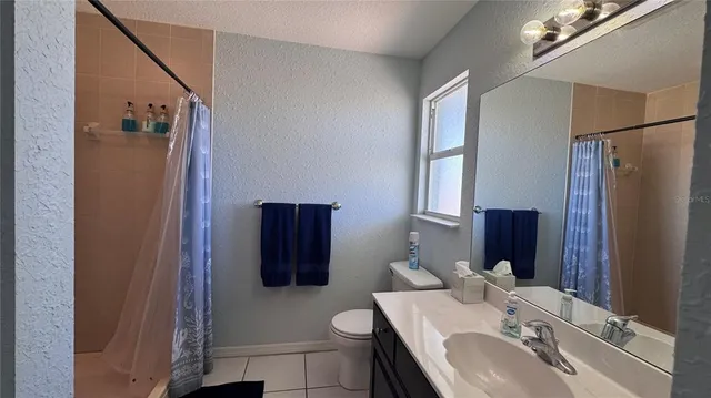 a table with chairs and wooden floor