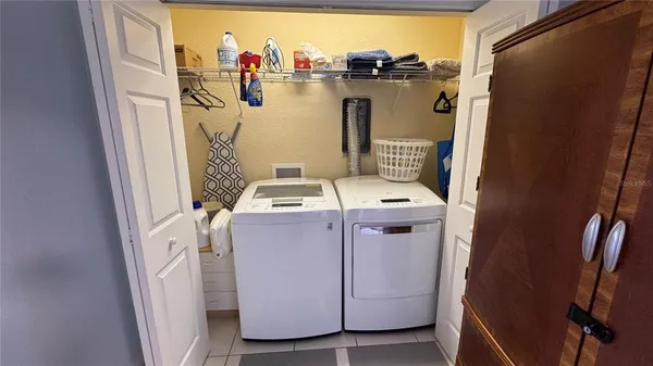 an aerial view of a house with outdoor seating