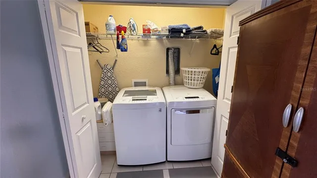 an aerial view of a house with outdoor seating