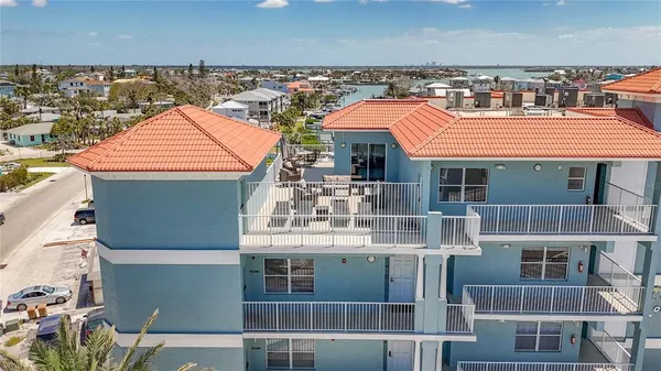 a view of balcony with furniture