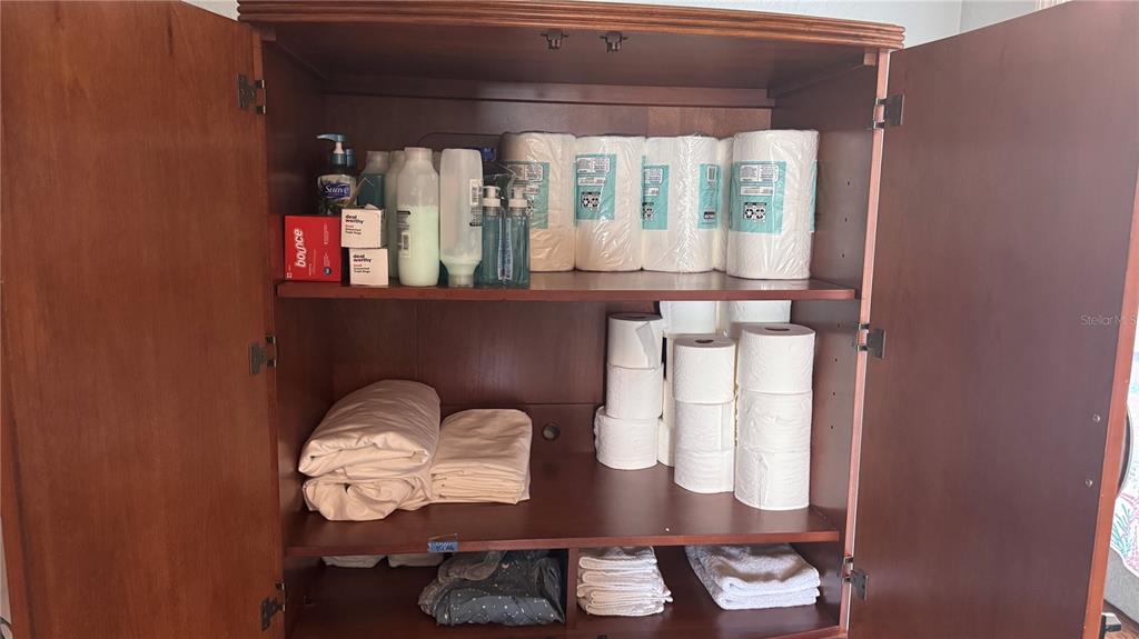 13999 Gulf Boulevard, Unit 501 Madeira Beach, FL 33708 - Photo 51 of 58 a table with chairs and wooden floor