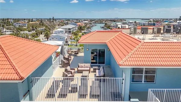 a view of balcony with furniture and deck