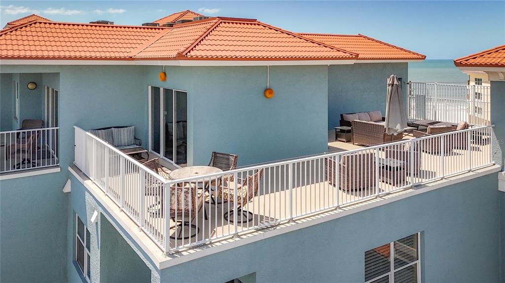 13999 Gulf Boulevard, Unit 501 Madeira Beach, FL 33708 - Photo 7 of 58 a view of balcony with furniture and deck