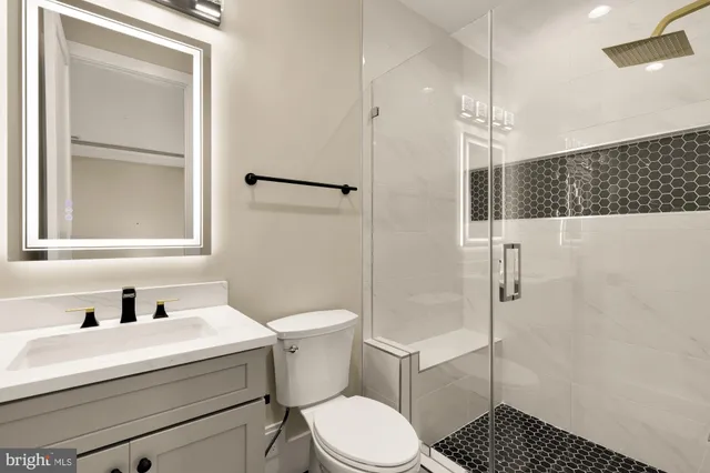 a view of a backyard with table and chairs and large tree