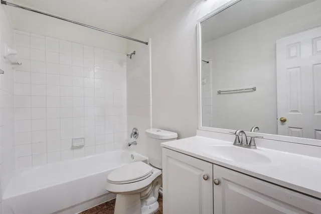 a bathroom with a sink a toilet and a bathtub