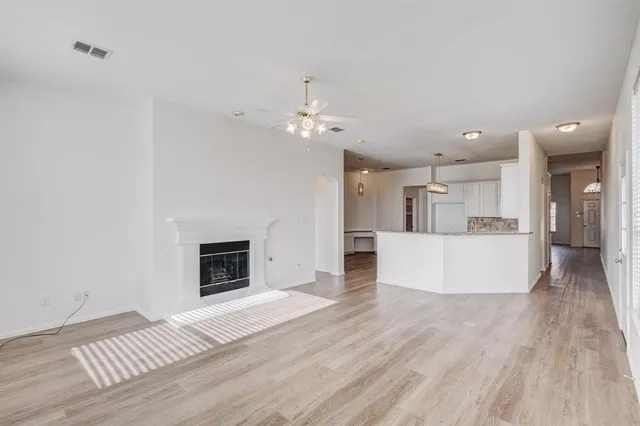 a view of a kitchen with furniture and a fireplace