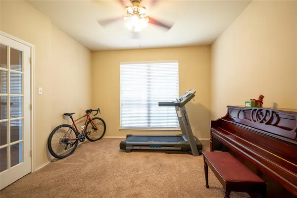 a bedroom with furniture and a window