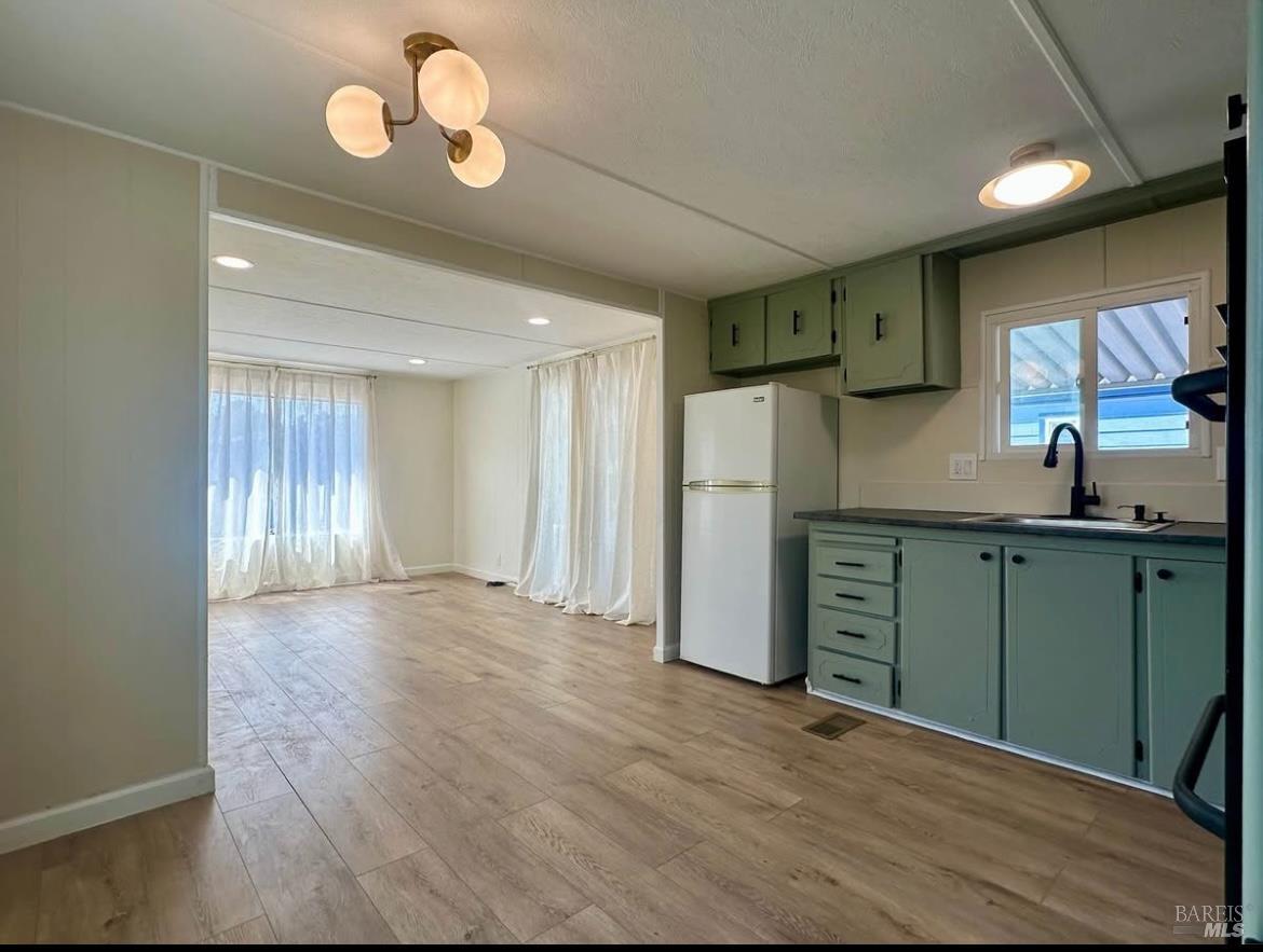 7 Geneseo Street Oakley, CA 94561 - Photo 3 of 9 a kitchen with stainless steel appliances granite countertop a refrigerator and a sink