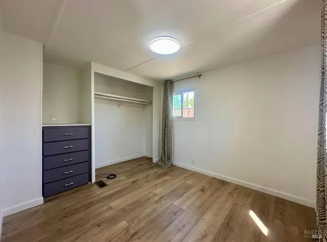 wooden floor and window in an empty room