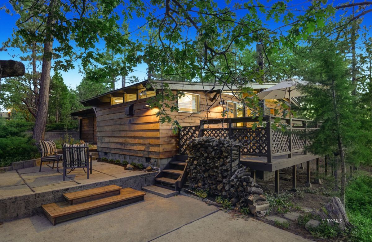 26780 Saunders Meadow Road Idyllwild, CA 92549 - Photo 1 of 41 a backyard of a house with table and chairs