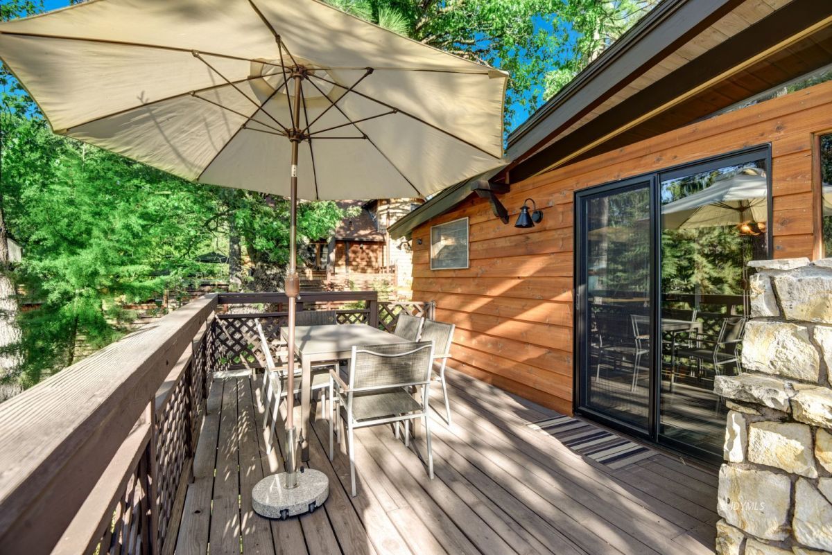 26780 Saunders Meadow Road Idyllwild, CA 92549 - Photo 11 of 41 a view of balcony with chairs and wooden fence