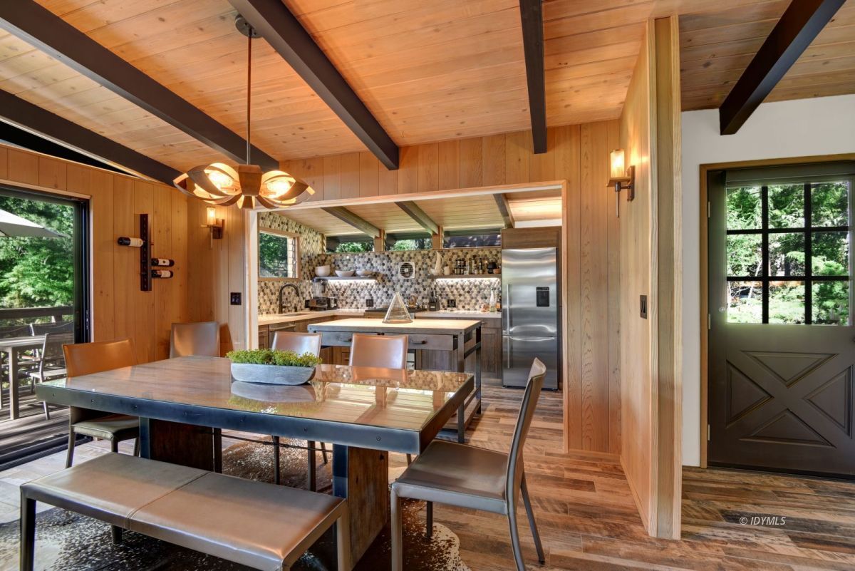 26780 Saunders Meadow Road Idyllwild, CA 92549 - Photo 17 of 41 a view of a dining room with furniture and wooden floor